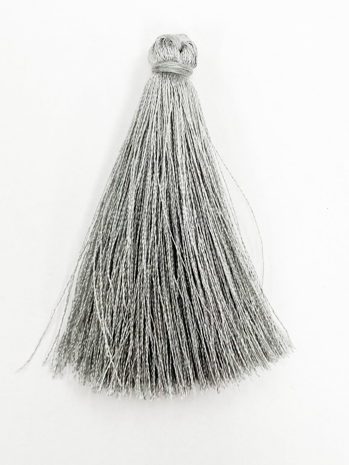 Light Grey Coloured Tassel, 65mmL x 10mm. Polyester fibre.