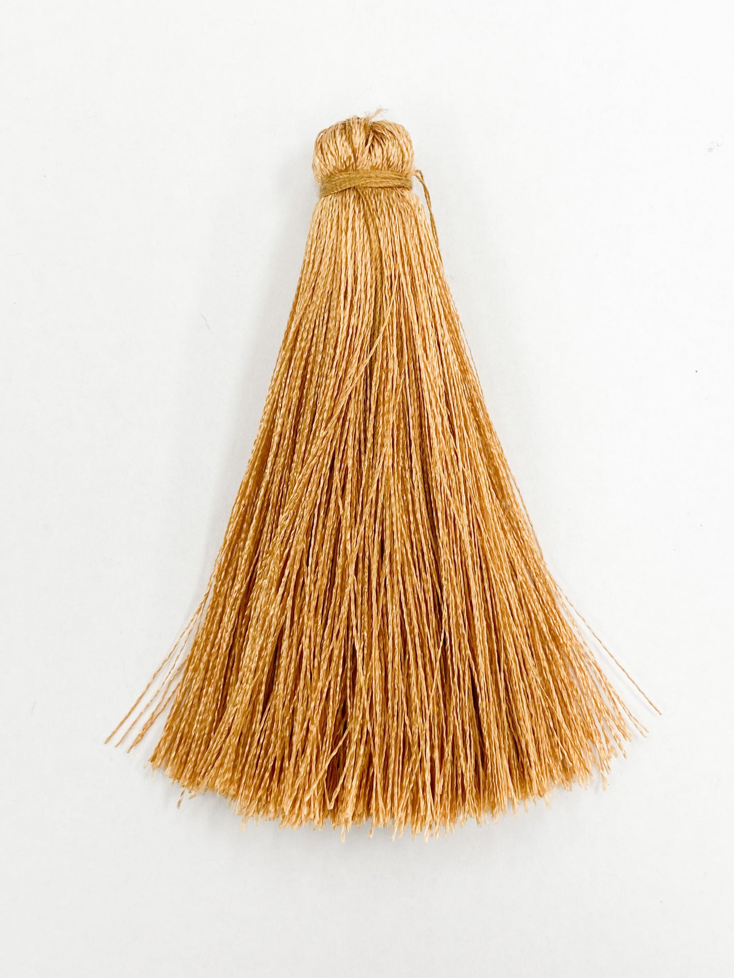 Tan Coloured Tassel, 65mmL x 10mm. Polyester fibre.
