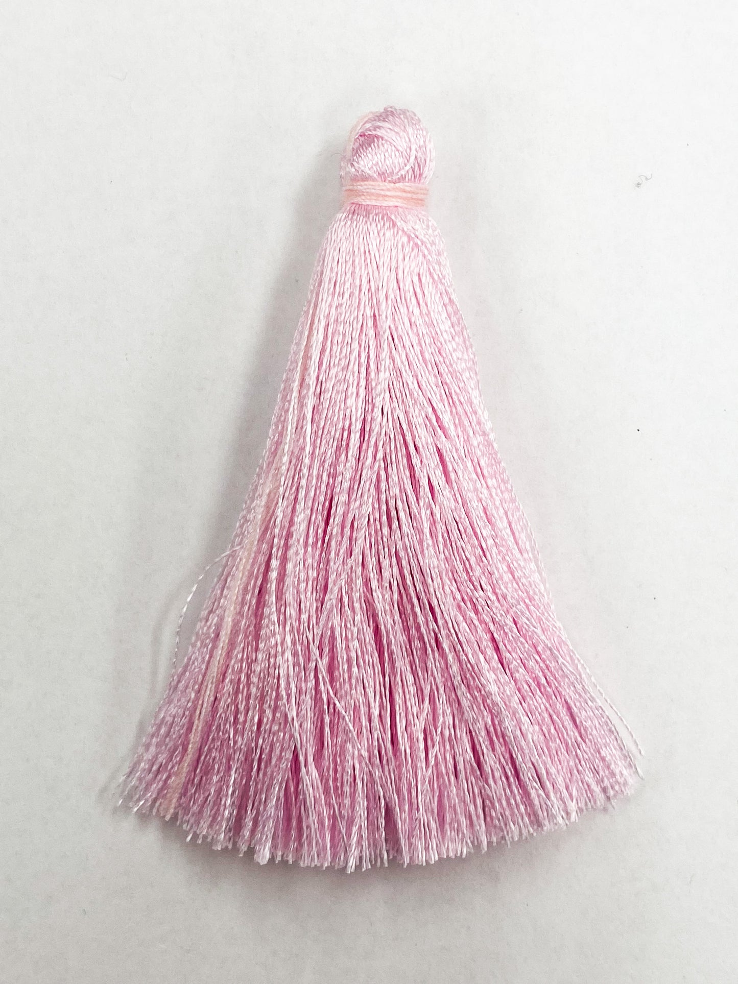 Light Pink Coloured Tassel, 65mmL x 10mm. Polyester fibre.